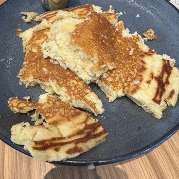 Dish Society - So hard to eat this giant pancake with a thimble of syrup - Southern Near Me - Austin, Texas