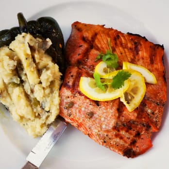 Grill Caliente - WILLIAMS BROS. SALMON $16 This summer's catch from Ruidoso's own, Char-grilled with a touch of olive oil - New American Near Me - Ruidoso, New Mexico