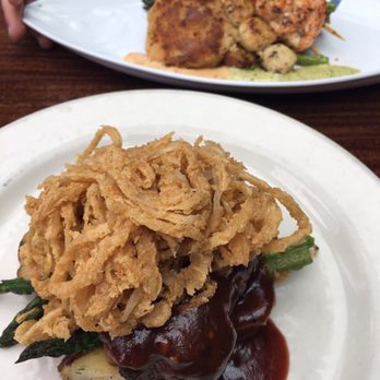 Duke's Seafood - First photo: filet mignon special. Second photo in back: Prawn, Scallop & Crab "Un" Cake Mixed Grill* - Seafood Near Me - Seattle, Washington