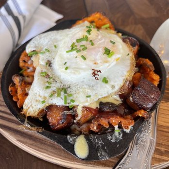 Divided Sky Tavern - Sweet Potato & Pork Belly Poutine with an egg added. - American Near Me - Fair Oaks, California