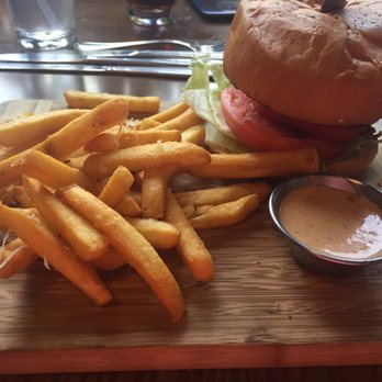 Pub Americana - Cajun burger with fries - Bars Near Me - Cocoa, Florida Pub Americana - Cajun burger with fries - Bars Near Me - Cocoa, Florida