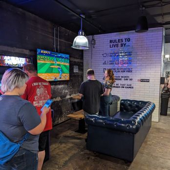 Pins Mechanical - a group of people playing a video game - Bowling Near Me - Cincinnati, Ohio Pins Mechanical - a group of people playing a video game - Bowling Near Me - Cincinnati, Ohio