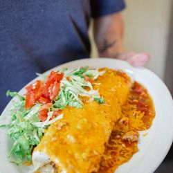 Greeley Breakfast Club - Breakfast Burrito smothered with homemade pork green chili.