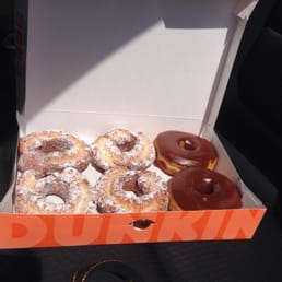 A box of perfection. Powdered sour cream donuts and chocolate glazed A box of perfection. Powdered sour cream donuts and chocolate glazed