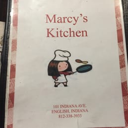 a cook holding a frying pan a cook holding a frying pan