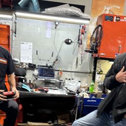 left is mechanic that dropped bike & right is service mgr who threatened to put a lien on my bike if I didn't sign waiver of responsibility