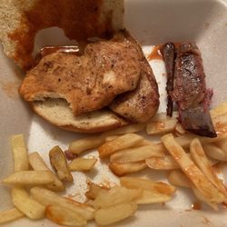 Charlie Staples Pitt Boss BBQ - A chicken sandwich rib bone and fries