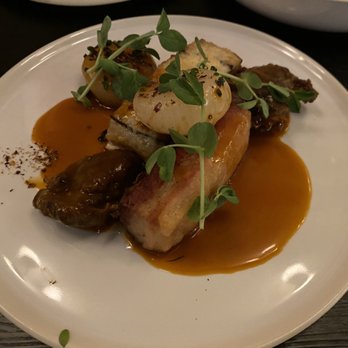 Forsythia - Crispy Pork - Cheek & Belly. Spring pea ragout, black pepper jus, hot honey - Modern European Near Me - Philadelphia, Pennsylvania Forsythia - Crispy Pork - Cheek & Belly. Spring pea ragout, black pepper jus, hot honey - Modern European Near Me - Philadelphia, Pennsylvania