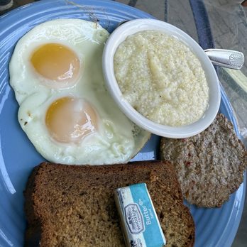 Blue Heaven - Sunny side up eggs with grits and their famous Banana Bread. - Breakfast & Brunch Near Me - Key West, Florida