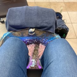 Unique Nails and Spa - Pedicures with an amazing massage chairs to relax in.  They also had relaxing music playing, very