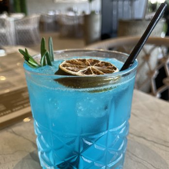 Baires Grill - Las Olas - a blue drink with a spoon in it - Argentine Near Me - Fort Lauderdale, Florida Baires Grill - Las Olas - a blue drink with a spoon in it - Argentine Near Me - Fort Lauderdale, Florida