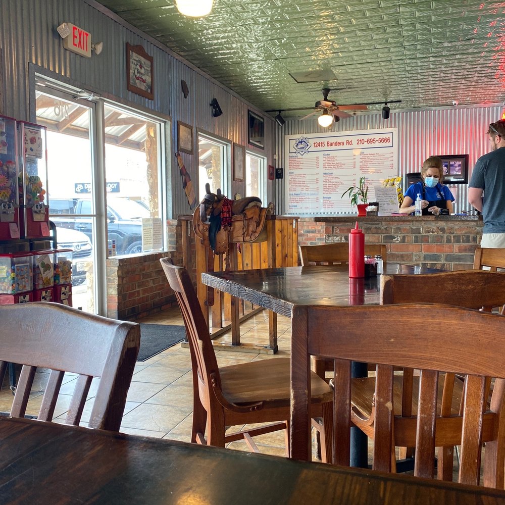 Babe's Old Fashioned Food - This saddle by the entrance looks too small for me. - Burgers Near Me - Helotes, Texas Babe's Old Fashioned Food - This saddle by the entrance looks too small for me. - Burgers Near Me - Helotes, Texas
