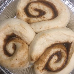 Cinnamon rolls after covering with a towel and allowing them to rise Cinnamon rolls after covering with a towel and allowing them to rise