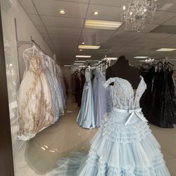 Esmeraldas Boutique Carrollwood - Window display looking in at Quinceanera / Bar Mitzvah dresses.