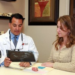 Jay R Lopez, DDS, PC - Dr. Lopez with a patient