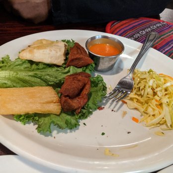 Antigua Guatemala Restaurant - Fried cassava with fried pieces of pork served with tomato sauce and seasoned cabbage - Latin American Near Me - Kent, Washington Antigua Guatemala Restaurant - Fried cassava with fried pieces of pork served with tomato sauce and seasoned cabbage - Latin American Near Me - Kent, Washington
