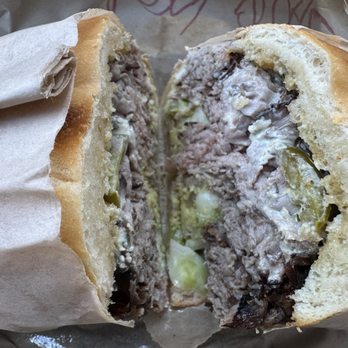 Deli Board - The Ron filled with delicious warm tender roast beef, melted cheese, and fixings on a crusty garlic roll - Delis Near Me - San Francisco, California