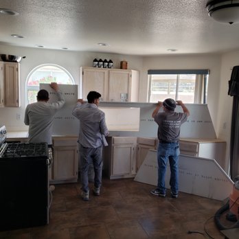 Signature Stone - two men working in a kitchen - Countertop Installation Near Me - Las Vegas, Nevada