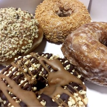 Glaze Donuts - West Caldwell - Caramel Apple (Top Left). Toasted Coconut (Top Right). Twix (Bottom Left). Glazed Cronut (Bottom Right). - Donuts Near Me - West Caldwell, New Jersey