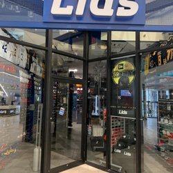 Lids - Doors sign reads, "open, come in". Doesn't look too open to me