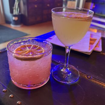 As Above, So Below Distillery - Thirteen cups (left) and Road to Chama (right). Road To Chama is a limited special edition drink - Distilleries Near Me - Santa Fe, New Mexico