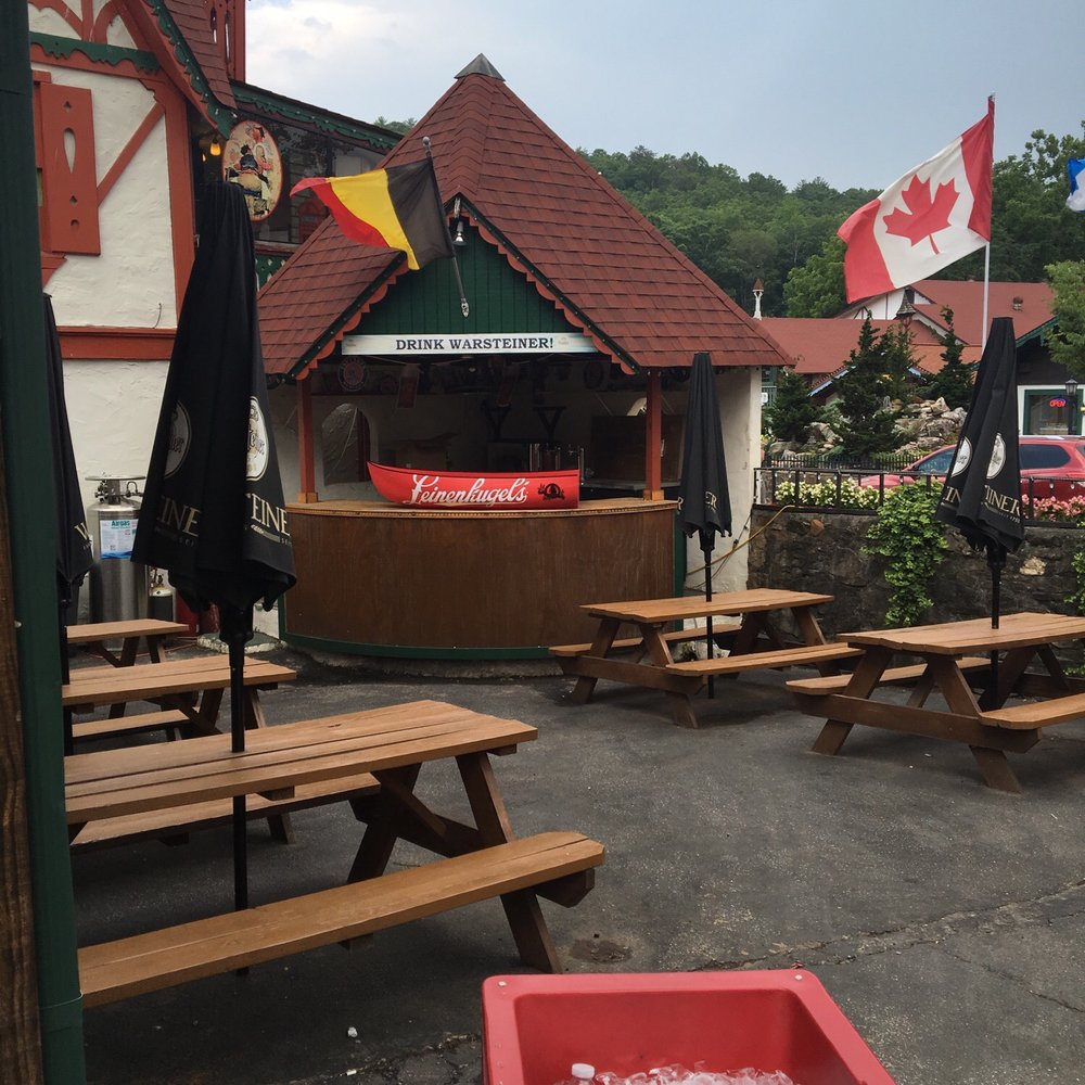 The Wurst House - a table with ice and a cooler - Bars Near Me - Helen, Georgia