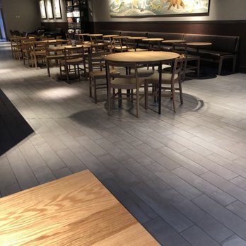 Starbucks - Just one of the areas for seating. There are bar stools and tables near the back, along with a community table (with built in plugs!) - Coffee & Tea Near Me - Columbus, Ohio Starbucks - Just one of the areas for seating. There are bar stools and tables near the back, along with a community table (with built in plugs!) - Coffee & Tea Near Me - Columbus, Ohio