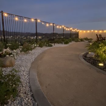 Nicolas Landscaping & Tree Service - a pathway leading to a restaurant - Lawn Services Near Me Nicolas Landscaping & Tree Service - a pathway leading to a restaurant - Lawn Services Near Me