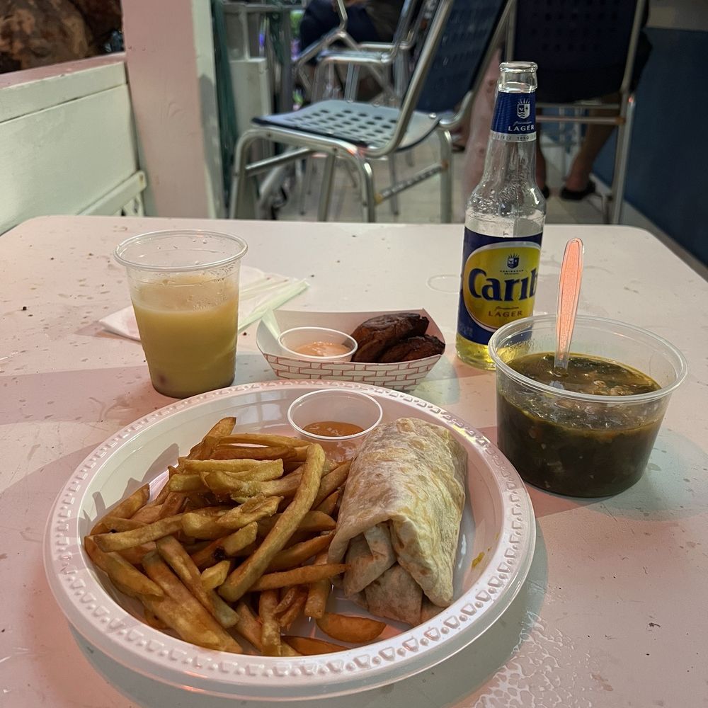 Chicken roti with fries, fried plantain and Kallaloo & crab soup Chicken roti with fries, fried plantain and Kallaloo & crab soup