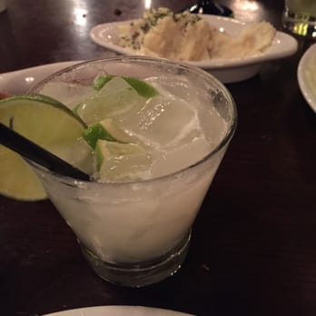 Texas de Brazil - Signature coconut drink with some garlic mash in the background! - Brazilian Near Me - Pittsburgh, Pennsylvania Texas de Brazil - Signature coconut drink with some garlic mash in the background! - Brazilian Near Me - Pittsburgh, Pennsylvania