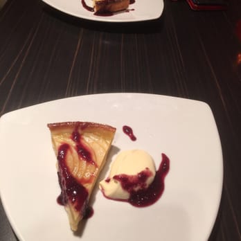 Alexander Bar - Apple Tart with a dollop of double cream & berry sauce. - Bars Near Me - Melbourne, VIC Alexander Bar - Apple Tart with a dollop of double cream & berry sauce. - Bars Near Me - Melbourne, VIC