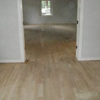 ABC Flooring - an empty room with wood floors - Flooring Near Me