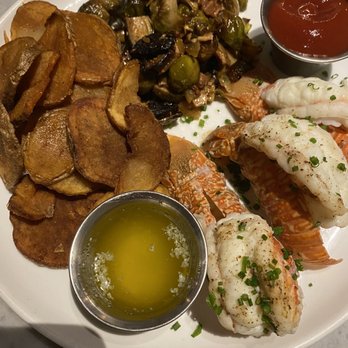Mignonette - West African lobster tails with Brussels sprouts and French fried potato chips - New American Near Me - Miami, Florida Mignonette - West African lobster tails with Brussels sprouts and French fried potato chips - New American Near Me - Miami, Florida