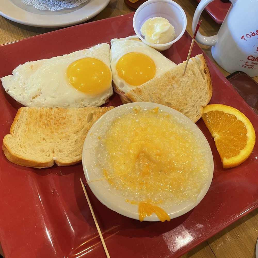 Toasted Mango Cafe - 2 eggs with cheesy grits and toast - Cafes Near Me - Sarasota, Florida Toasted Mango Cafe - 2 eggs with cheesy grits and toast - Cafes Near Me - Sarasota, Florida