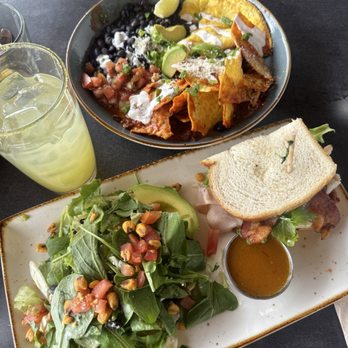 First Watch - 2 for you (chicken avocado salad and Monterey club)  (top) barbacoa chilaquiles  pineapple express juice - Breakfast & Brunch Near Me - Henderson, Nevada