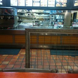 Taco Bueno - No one at the counter. All the employees went to the back to socialize.