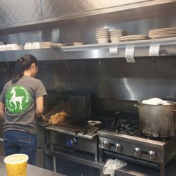 Lee's Kitchen - This young lady is preparing fresh fried chicken for the rice