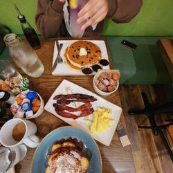 Donut holes, million dollar bacon, scrambled eggs, strawberry tres leches French toast, blueberry pancakes, coffee, purple haze