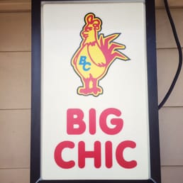 a chicken on a sign a chicken on a sign