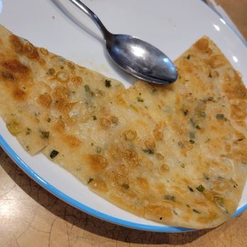 Porridge & Things - Green onion pancake.. pretty thin but overall good flavor - Chinese Near Me - Millbrae, California Porridge & Things - Green onion pancake.. pretty thin but overall good flavor - Chinese Near Me - Millbrae, California