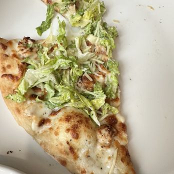 Vintage Restaurant and Lounge - a slice of pizza on a plate - Lounges Near Me - Boston, Massachusetts Vintage Restaurant and Lounge - a slice of pizza on a plate - Lounges Near Me - Boston, Massachusetts