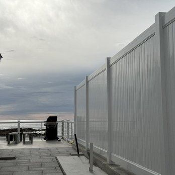 Platinum Fence - White Vinyl Privacy built on a Retaining wall - Fences & Gates Near Me - Hampton, New Hampshire Platinum Fence - White Vinyl Privacy built on a Retaining wall - Fences & Gates Near Me - Hampton, New Hampshire
