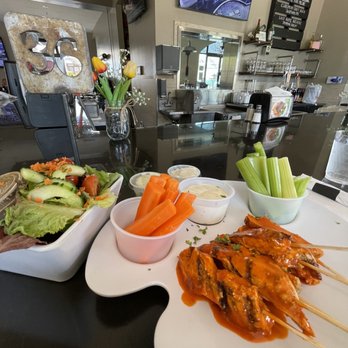 Dr Grubb's - Boneless buffalo chicken skewers and side salad to start. - American Near Me - Claremont, California