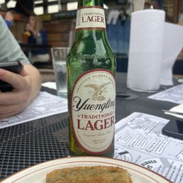 Lager beer with a fried pickle