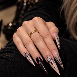 Halloween-inspired stiletto nails intricate hand-painted details, sharp shape, and a little spooky edge. Halloween-inspired stiletto nails intricate hand-painted details, sharp shape, and a little spooky edge.