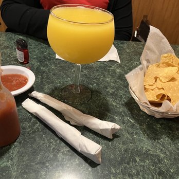 Dos Primos Mexican Restaurant - Mango margarita with chips and salsa. - Mexican Near Me - O Fallon, Missouri