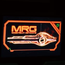 Mass Effect: New Earth Ride - Logo for Mass Relay Getaways on screen above entrances.