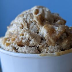 The Local Scoop - Banana Foster Ice Cream made with banana ice cream and bananas sauteed with rum, brown sugar and caramel, ribboned throughout