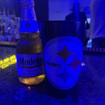 Steel City Grill - a bottle of beer and a mug - Sports Bars Near Me - Atlanta, Georgia Steel City Grill - a bottle of beer and a mug - Sports Bars Near Me - Atlanta, Georgia