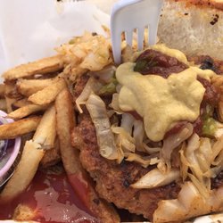 Jo's World Famous Schnitzel Wagon - Their über yummy brat with sauerkraut and grilled onions! Super delicious! Breaks the monotony with eating at Helen's! $10.50.